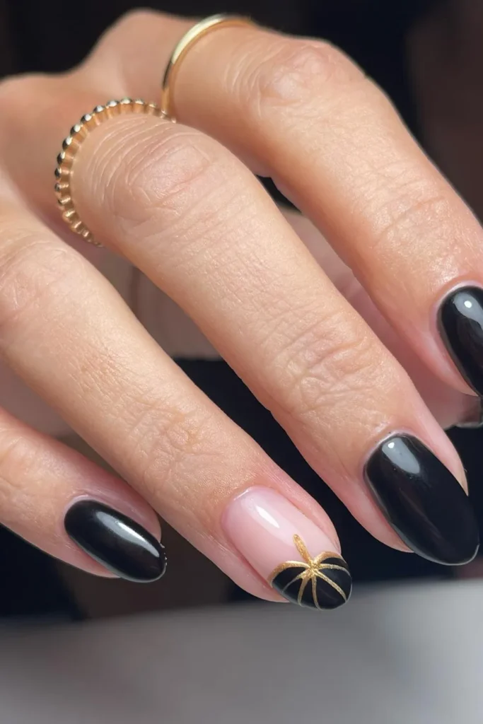 Glossy Black Nails With a Gold Ribbon Gift Tip