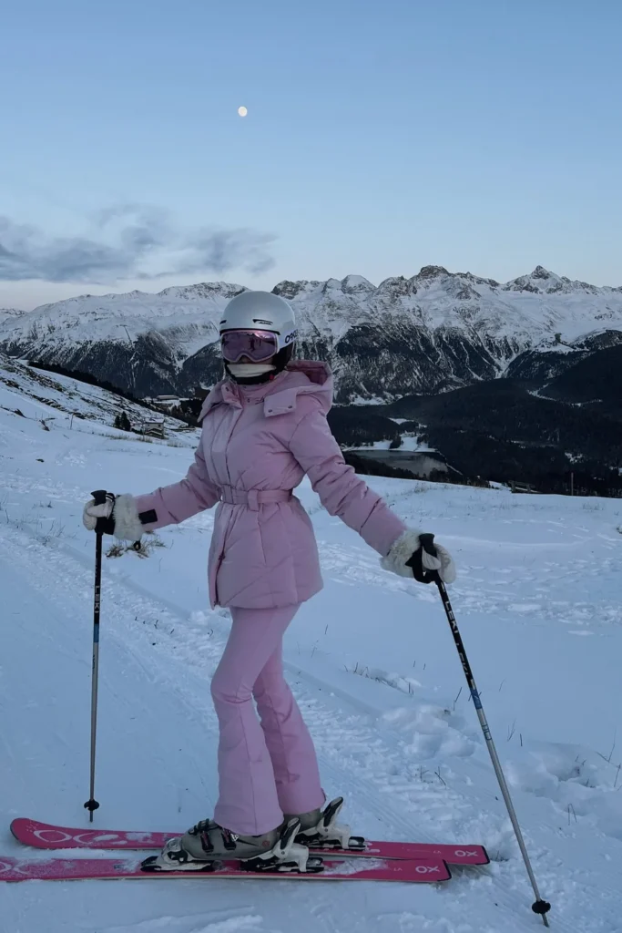 Pink Belted Ski Jacket and Flared Ski Pants at Dusk