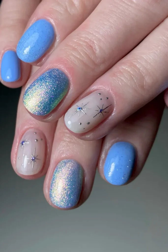 Short Cornflower Blue Nails With Holo Shimmer and Silver Stars