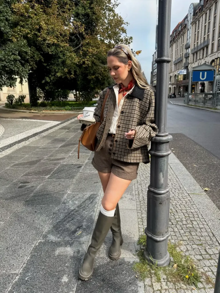 A Checked Wool Cardigan Jacket With Tweed Shorts and Tall Boots