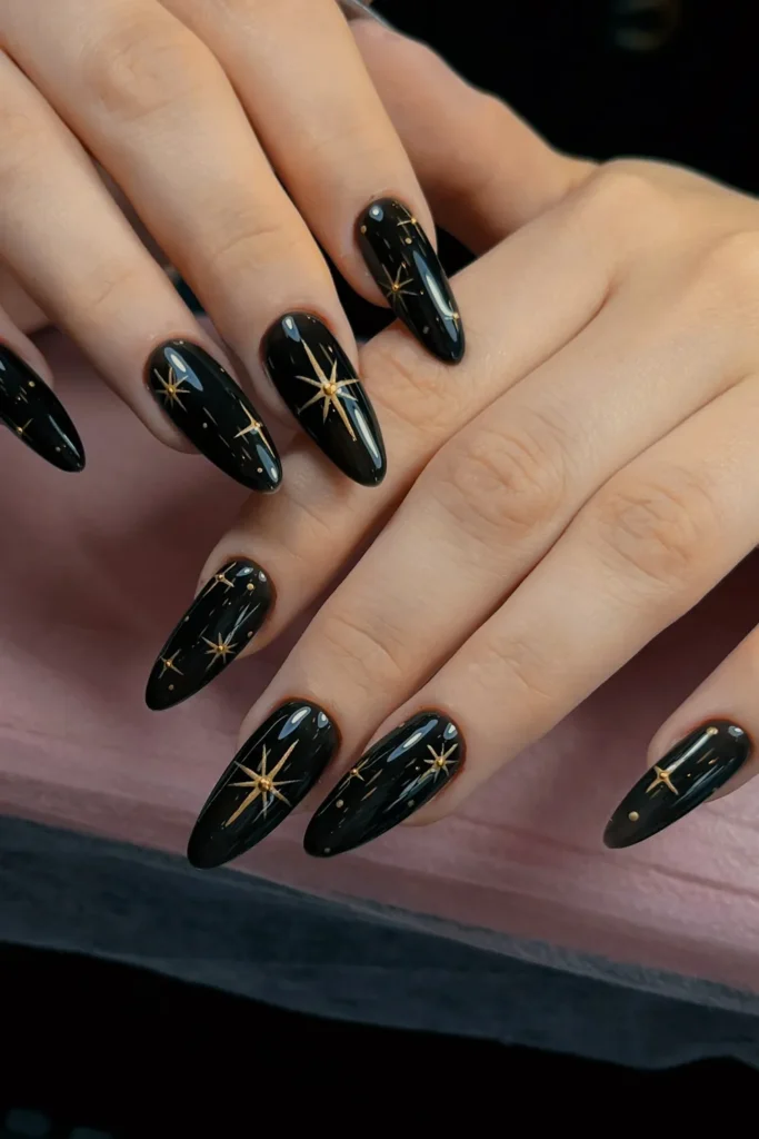 Black and Gold Christmas Nails With Starbursts