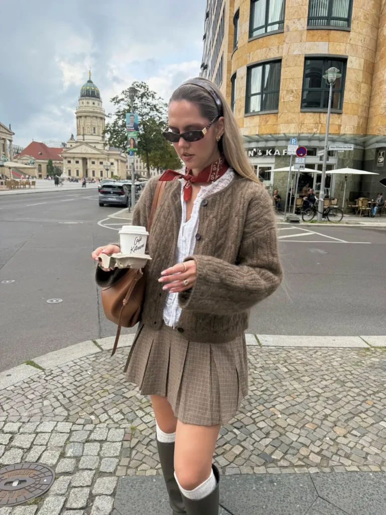 A Brown Cable Knit Cardigan and a Houndstooth Pleated Skirt