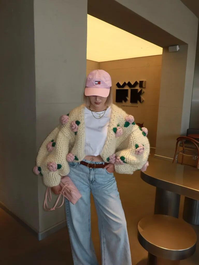 A Chunky Rose Cardigan With Light Wash Jeans