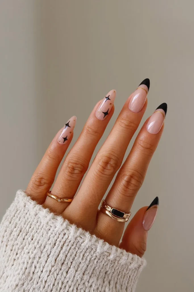 Black French Tip Christmas Nails With Gold Lines and Stars