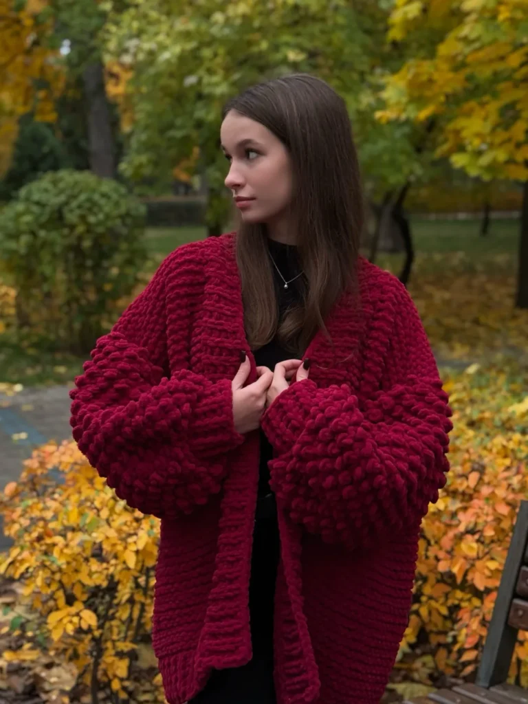 An Oversized Berry Red Cardigan Over All Black