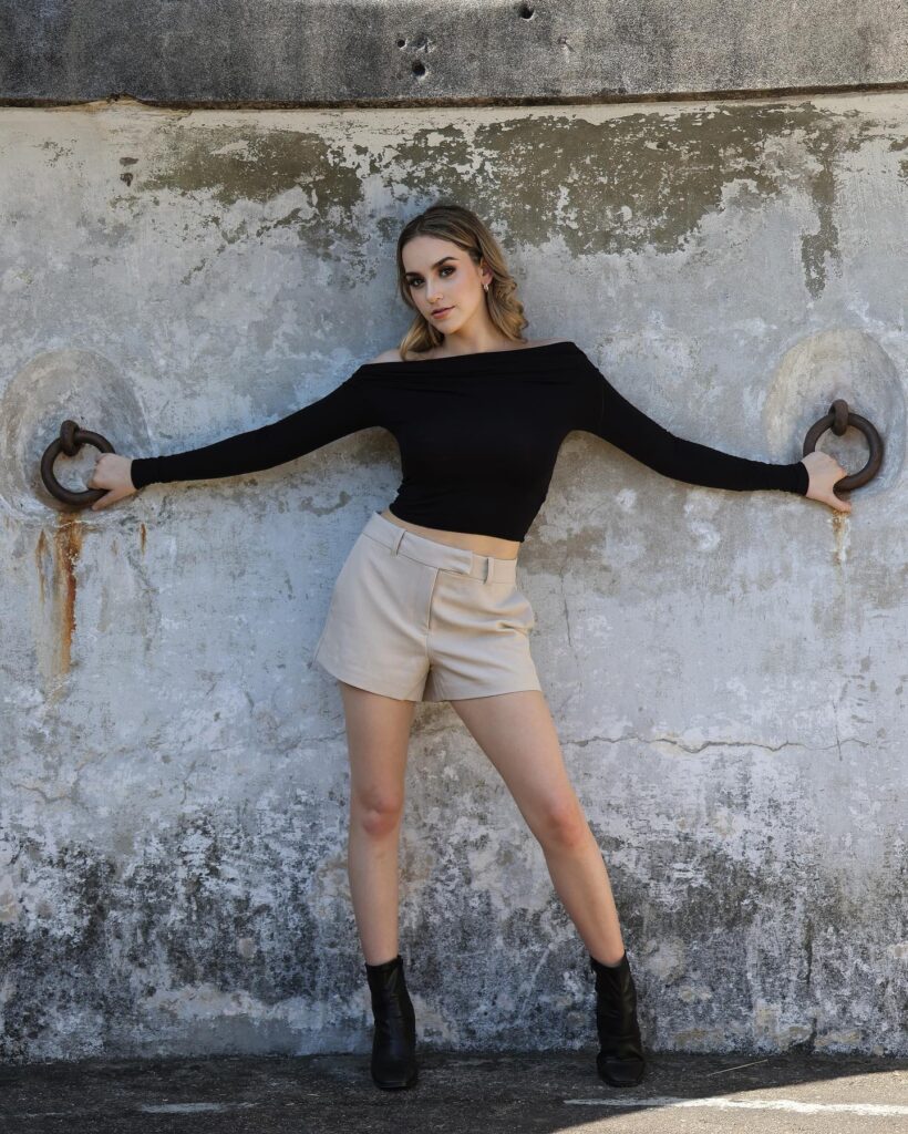 Black Off-Shoulder Top With Tailored Beige Shorts