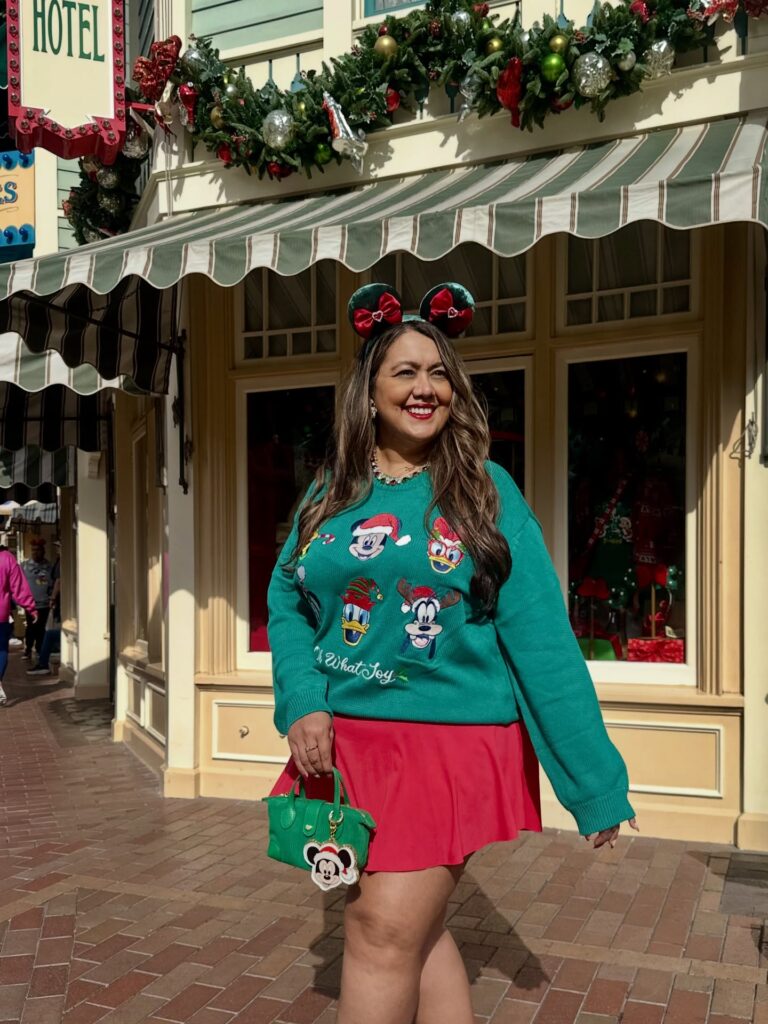 Green Disney Sweater With a Bright Red Skirt