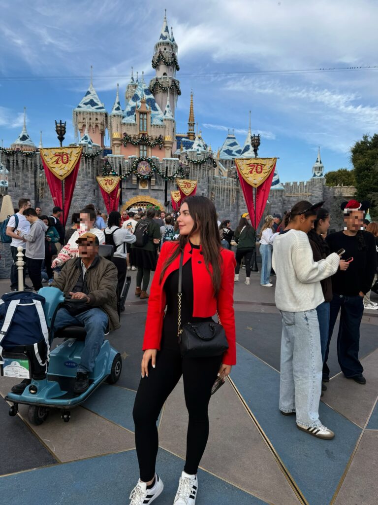 Mickey Holiday Sweater With Red Tights and a Mini Skirt
