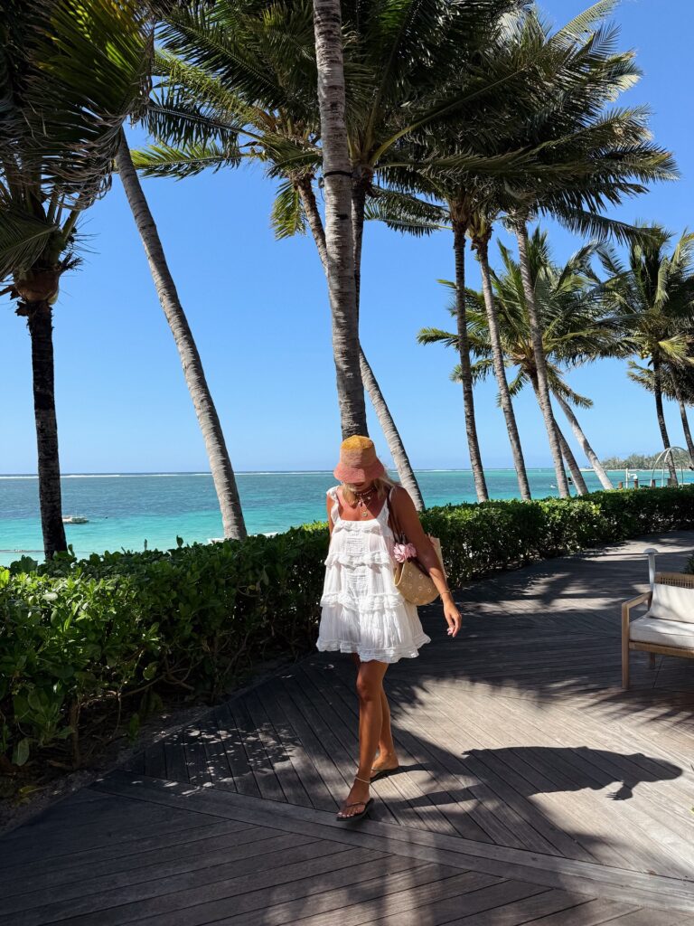 White Ruffle Mini Dress With a Woven Sun Hat